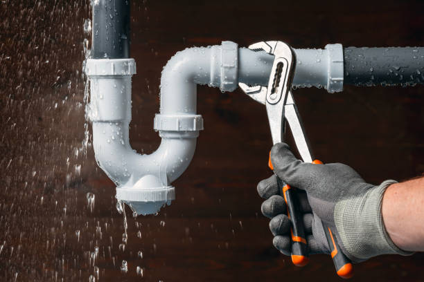 Professional Plumber technician working in Ames, TX